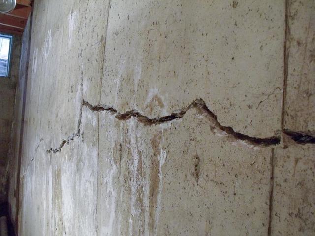 basement wall with large crack from water