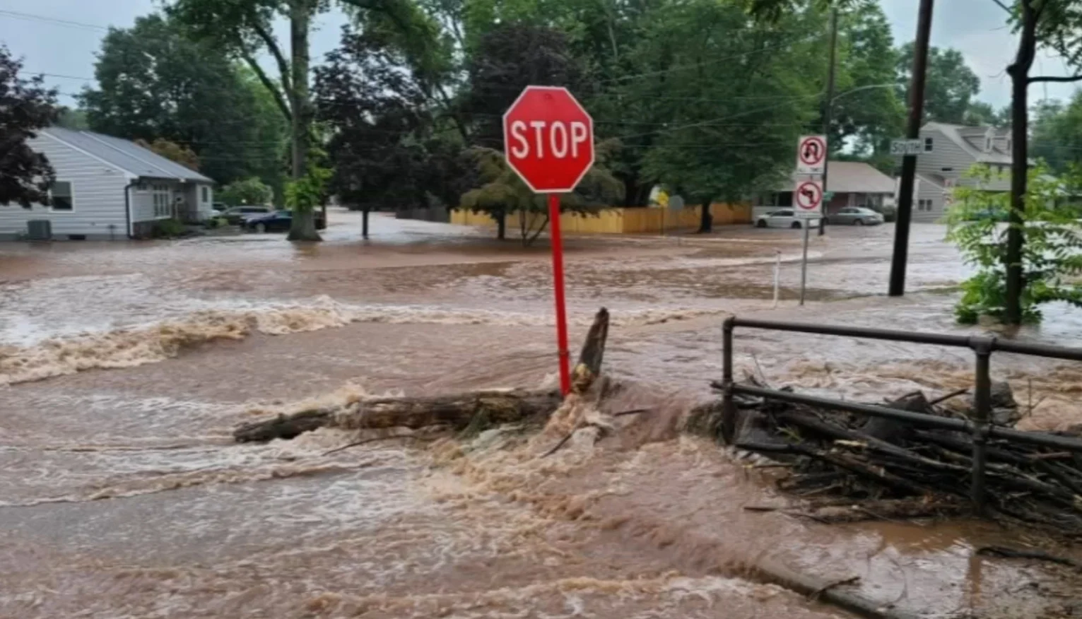 how to protect house from flood going down the street and engulfing stop sign