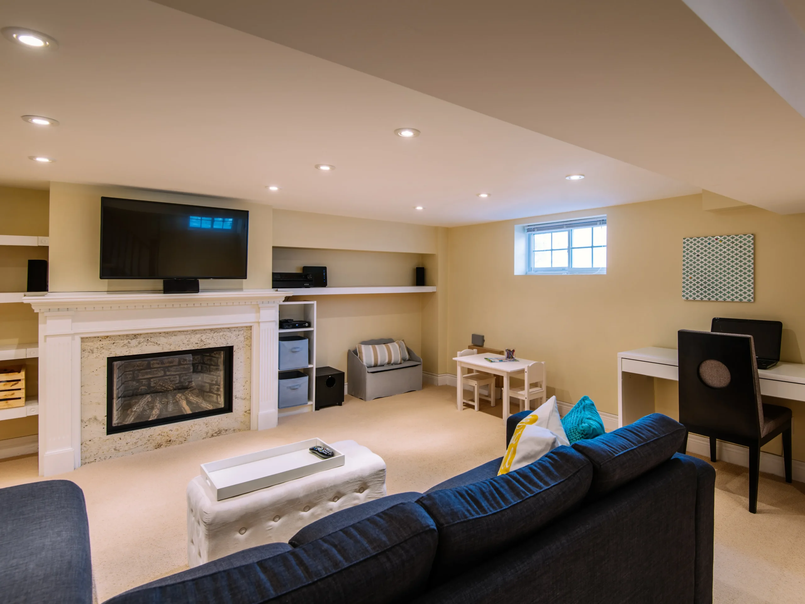 Protecting Your Basement in Winter - finished basement in home with couch, television, and more