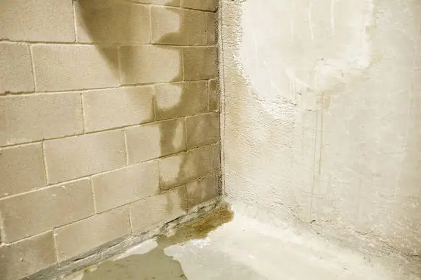 water coming through basement wall; leaking basement wall